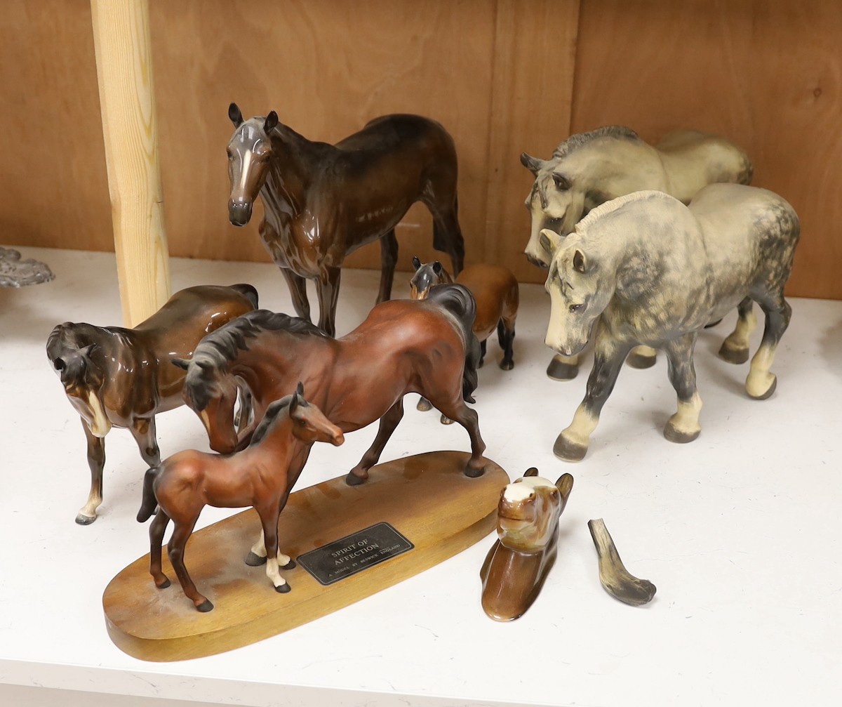 A collection three single Beswick horses, a group figure of a mother and foal, a wall pocket and two Lenham pottery shire horses, tallest 28 cm